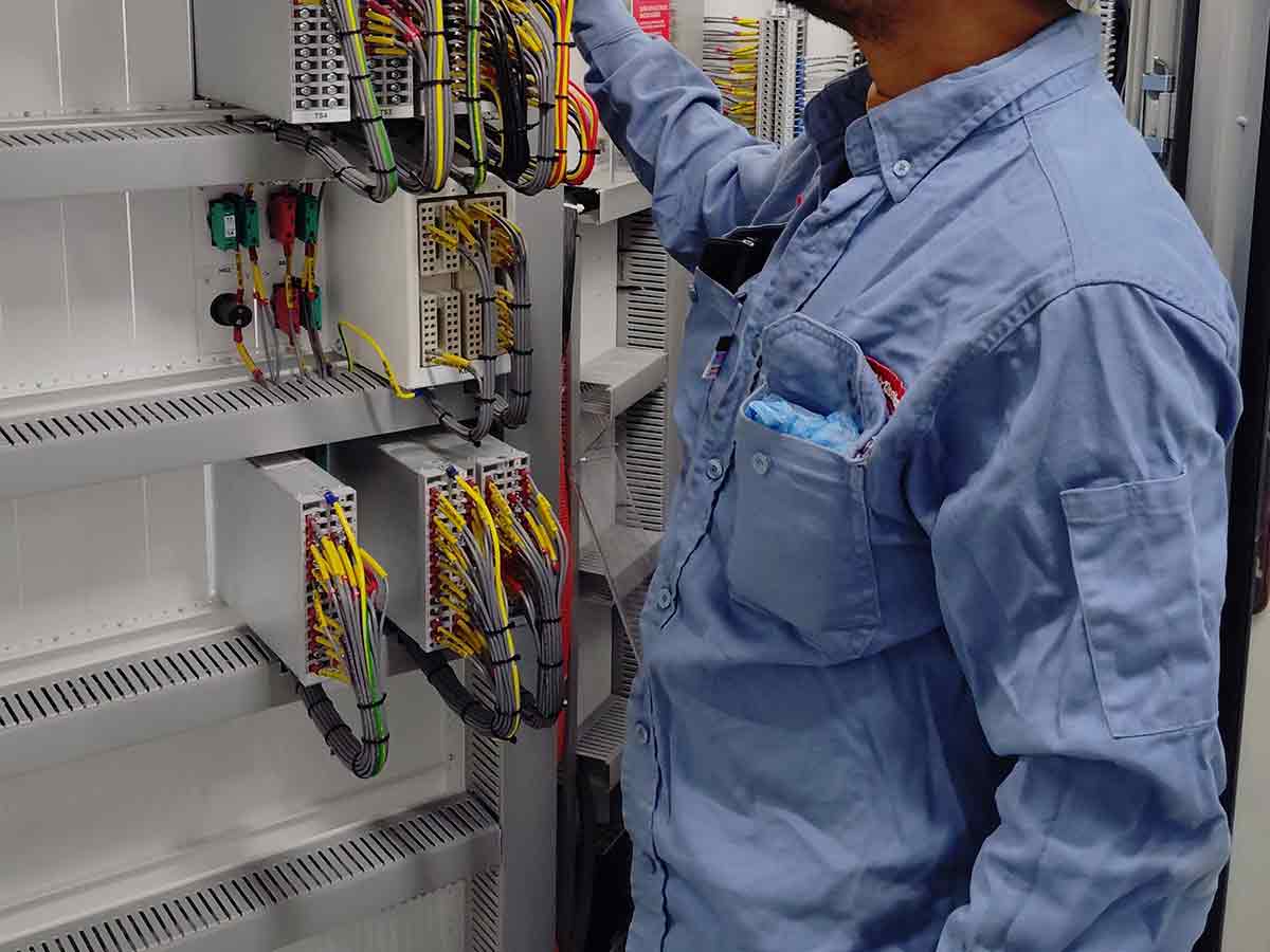 System integrator installing a synchronized clock