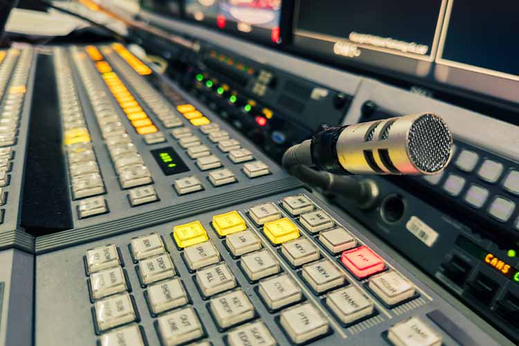 Broadcast clock system time server for synchronized studio and control room clocks